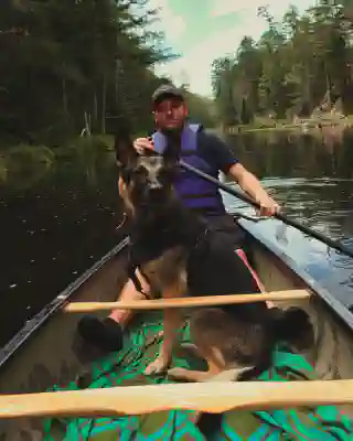 Georg and Momo in the canoe. Georg is paddling.