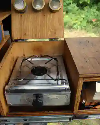 The alcohol stove in our cooking box. Protected from side wind.