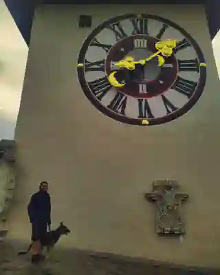 The clock tower in Graz, with Georg and Momo in front of it