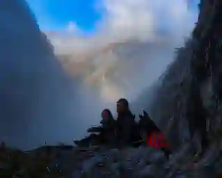 Jo, Georg, and Momo on the Chemin de la Mature. The view is somewhat cloudy, but the mountain panorama shines through