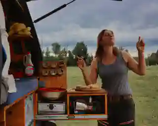 Jo prepares the cinnamon roll on our extendable outdoor kitchen. The Omnia is still on the stove.