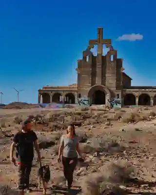 In the background is the bell tower of the monastery.