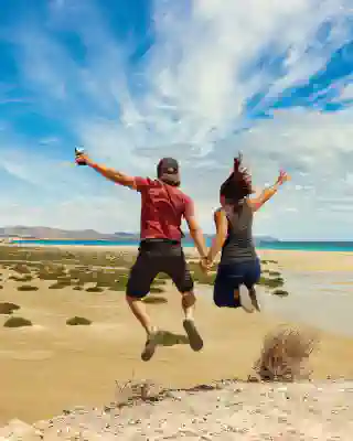 Jumping photo of Georg, Jo at the lagoon.