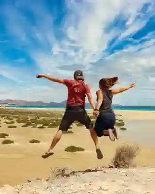 Jumping photo of Georg, Jo at the lagoon.