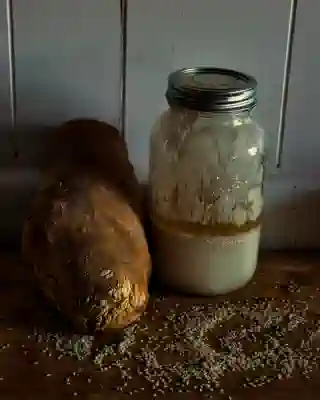 Our sourdough starter and one of the delicious sourdough breads.