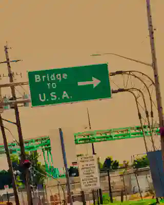 The sign &lsquo;Bridge to U.S.A. The mood of the picture is very active.&rsquo;