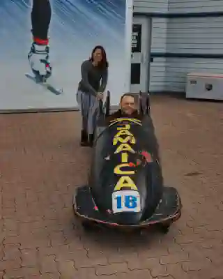 Georg in the bobsleigh used by the Jamaican bobsleigh team in the film.